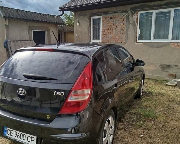 Черный Хендай i30, объемом двигателя 1.4 л и пробегом 215 тыс. км за 5500 $, фото 5 на Automoto.ua