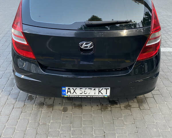 Черный Хендай i30, объемом двигателя 1.4 л и пробегом 194 тыс. км за 6000 $, фото 2 на Automoto.ua