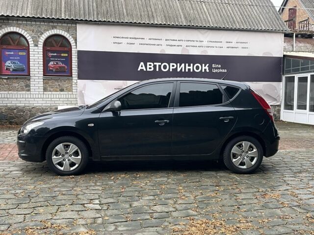 Черный Хендай i30, объемом двигателя 1.4 л и пробегом 240 тыс. км за 6000 $, фото 4 на Automoto.ua