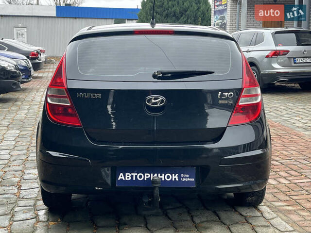 Черный Хендай i30, объемом двигателя 1.4 л и пробегом 240 тыс. км за 6000 $, фото 5 на Automoto.ua