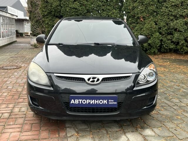 Черный Хендай i30, объемом двигателя 1.4 л и пробегом 240 тыс. км за 6000 $, фото 6 на Automoto.ua