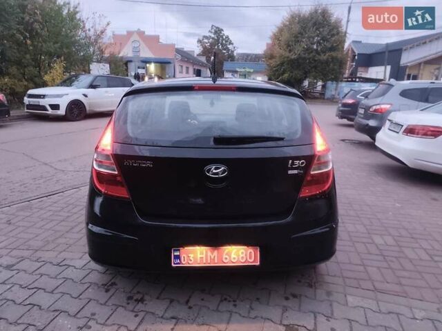 Чорний Хендай i30, об'ємом двигуна 1.4 л та пробігом 158 тис. км за 5750 $, фото 7 на Automoto.ua