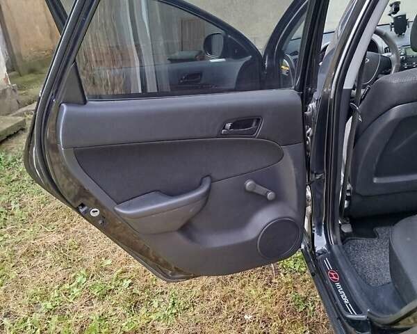 Черный Хендай i30, объемом двигателя 1.4 л и пробегом 215 тыс. км за 5000 $, фото 12 на Automoto.ua