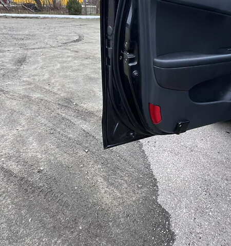 Черный Хендай i30, объемом двигателя 1.6 л и пробегом 255 тыс. км за 6800 $, фото 4 на Automoto.ua