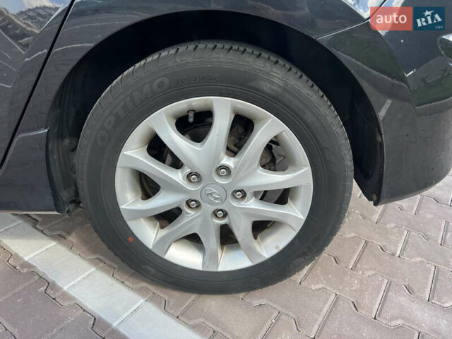 Чорний Хендай i30, об'ємом двигуна 1.4 л та пробігом 248 тис. км за 6950 $, фото 3 на Automoto.ua