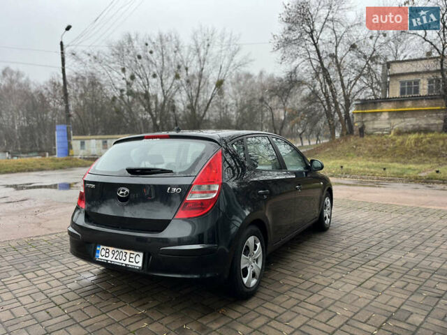 Чорний Хендай i30, об'ємом двигуна 1.4 л та пробігом 247 тис. км за 5800 $, фото 4 на Automoto.ua