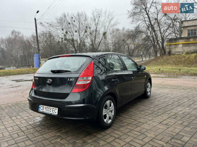 Чорний Хендай i30, об'ємом двигуна 1.4 л та пробігом 247 тис. км за 5800 $, фото 5 на Automoto.ua