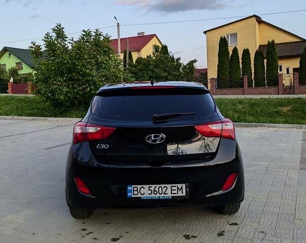 Черный Хендай i30, объемом двигателя 1.4 л и пробегом 138 тыс. км за 8700 $, фото 3 на Automoto.ua
