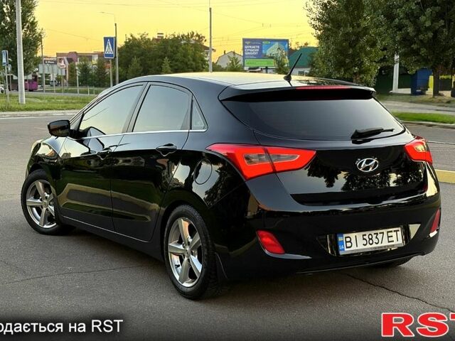 Чорний Хендай i30, об'ємом двигуна 1.6 л та пробігом 160 тис. км за 8699 $, фото 5 на Automoto.ua