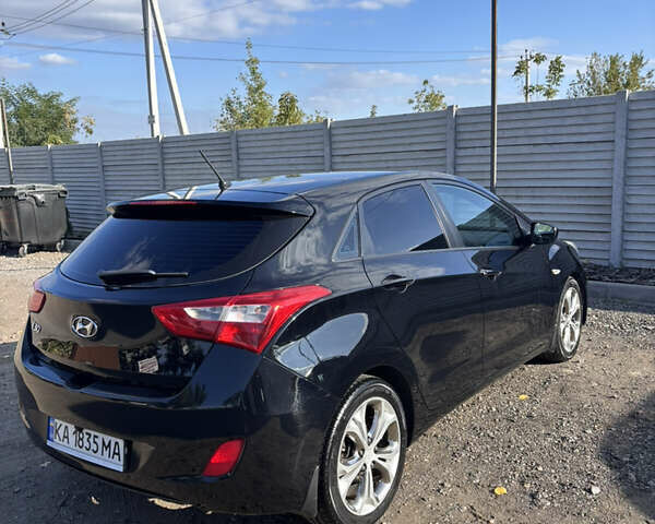 Черный Хендай i30, объемом двигателя 1.58 л и пробегом 160 тыс. км за 10900 $, фото 4 на Automoto.ua