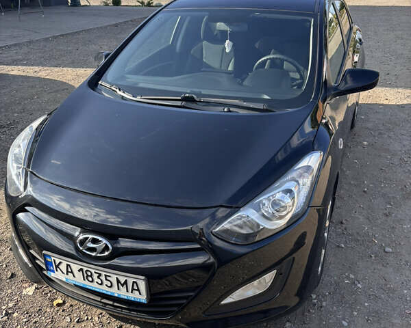 Черный Хендай i30, объемом двигателя 1.58 л и пробегом 160 тыс. км за 10900 $, фото 2 на Automoto.ua