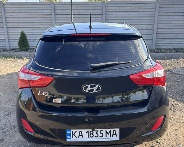 Черный Хендай i30, объемом двигателя 1.58 л и пробегом 160 тыс. км за 10900 $, фото 3 на Automoto.ua