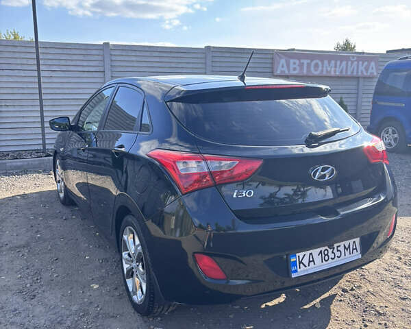 Черный Хендай i30, объемом двигателя 1.58 л и пробегом 160 тыс. км за 10900 $, фото 5 на Automoto.ua