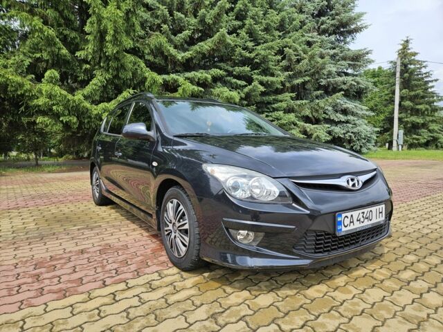 Черный Хендай i30, объемом двигателя 1.4 л и пробегом 157 тыс. км за 6700 $, фото 2 на Automoto.ua