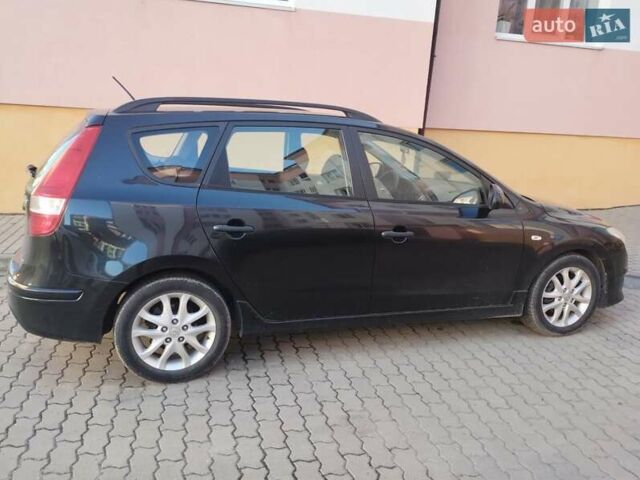 Черный Хендай i30, объемом двигателя 1.58 л и пробегом 190 тыс. км за 7100 $, фото 4 на Automoto.ua