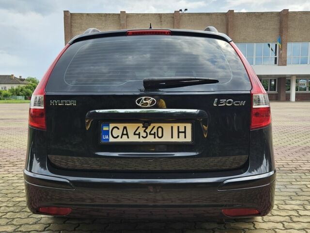 Черный Хендай i30, объемом двигателя 1.4 л и пробегом 157 тыс. км за 6700 $, фото 5 на Automoto.ua
