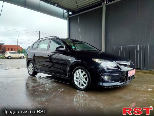 Черный Хендай i30, объемом двигателя 1.4 л и пробегом 135 тыс. км за 6500 $, фото 6 на Automoto.ua