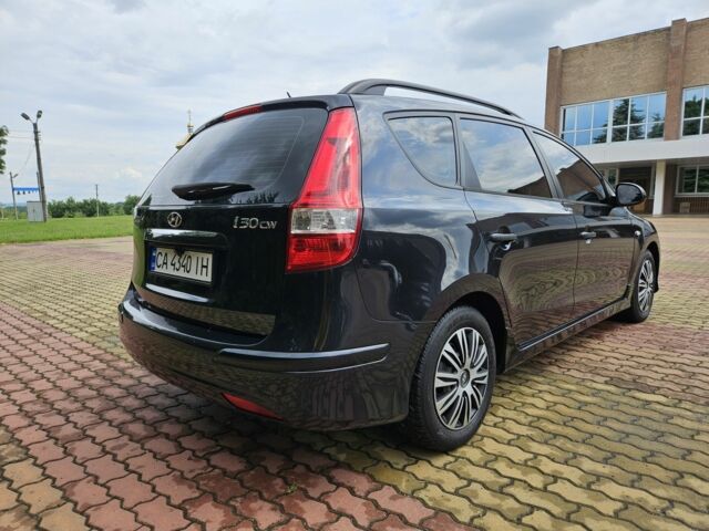 Черный Хендай i30, объемом двигателя 1.4 л и пробегом 157 тыс. км за 6700 $, фото 4 на Automoto.ua