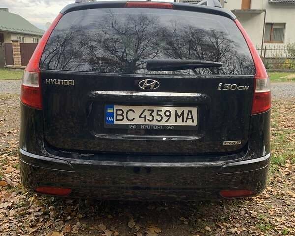 Черный Хендай i30, объемом двигателя 1.58 л и пробегом 235 тыс. км за 6700 $, фото 4 на Automoto.ua