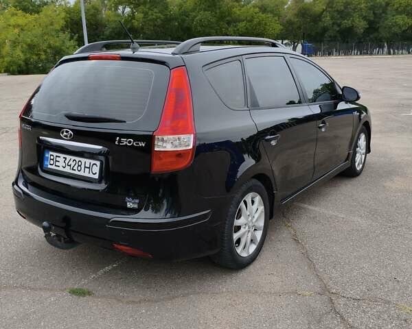 Черный Хендай i30, объемом двигателя 1.4 л и пробегом 137 тыс. км за 7500 $, фото 1 на Automoto.ua
