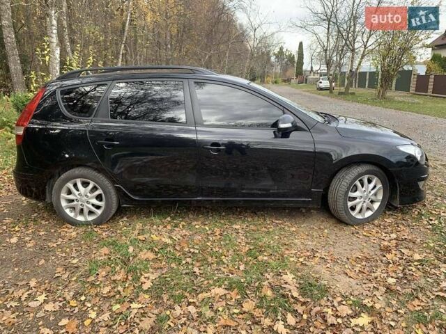 Черный Хендай i30, объемом двигателя 1.58 л и пробегом 235 тыс. км за 6700 $, фото 3 на Automoto.ua