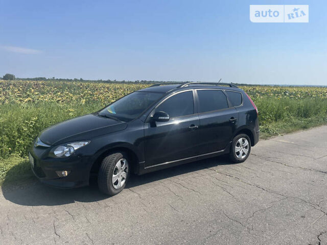 Чорний Хендай i30, об'ємом двигуна 1.4 л та пробігом 160 тис. км за 7499 $, фото 1 на Automoto.ua