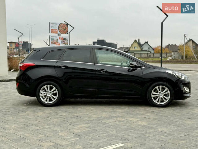 Чорний Хендай i30, об'ємом двигуна 1.6 л та пробігом 202 тис. км за 12500 $, фото 1 на Automoto.ua