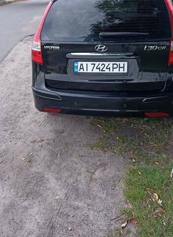 Чорний Хендай i30, об'ємом двигуна 1.59 л та пробігом 145 тис. км за 6499 $, фото 4 на Automoto.ua