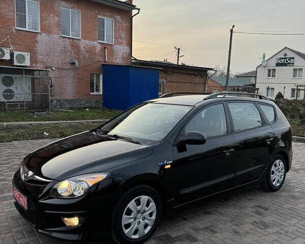Черный Хендай i30, объемом двигателя 1.4 л и пробегом 210 тыс. км за 6750 $, фото 4 на Automoto.ua