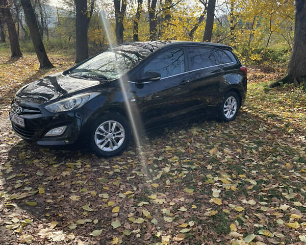 Черный Хендай i30, объемом двигателя 1.58 л и пробегом 290 тыс. км за 10800 $, фото 1 на Automoto.ua