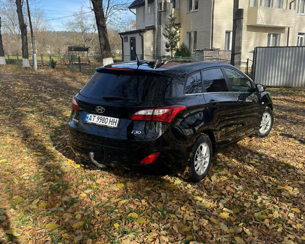 Черный Хендай i30, объемом двигателя 1.58 л и пробегом 290 тыс. км за 10800 $, фото 2 на Automoto.ua
