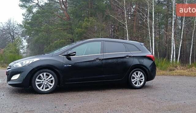 Черный Хендай i30 Wagon, объемом двигателя 1.6 л и пробегом 236 тыс. км за 8999 $, фото 3 на Automoto.ua