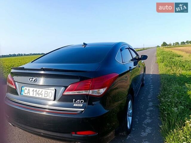 Черный Хендай и40, объемом двигателя 1.69 л и пробегом 215 тыс. км за 9300 $, фото 7 на Automoto.ua