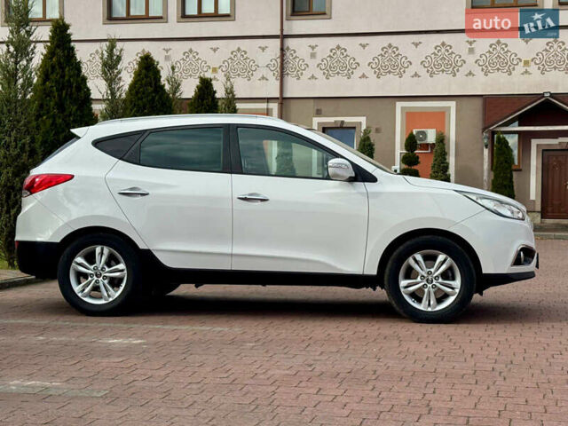 Білий Хендай іх35, об'ємом двигуна 2 л та пробігом 169 тис. км за 13800 $, фото 12 на Automoto.ua