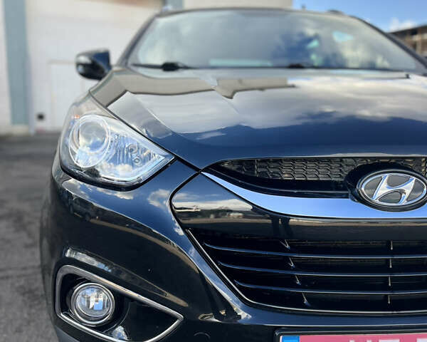 Чорний Хендай іх35, об'ємом двигуна 2 л та пробігом 225 тис. км за 12999 $, фото 14 на Automoto.ua