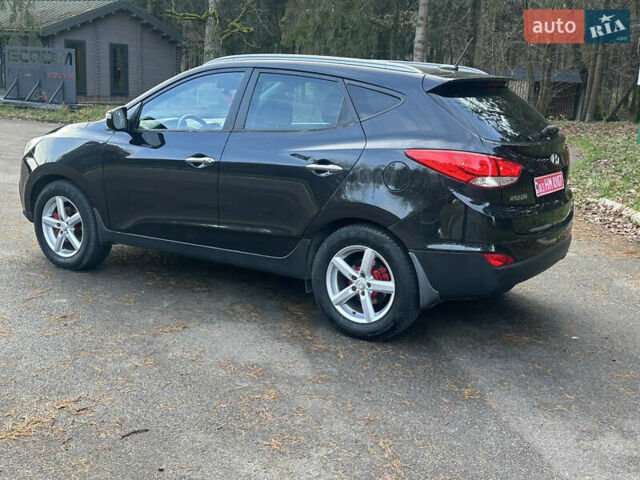 Чорний Хендай іх35, об'ємом двигуна 2 л та пробігом 240 тис. км за 12500 $, фото 5 на Automoto.ua