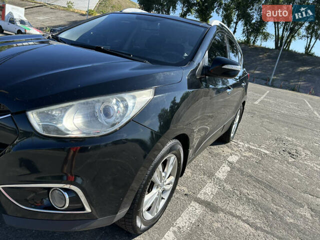 Чорний Хендай іх35, об'ємом двигуна 2 л та пробігом 196 тис. км за 12900 $, фото 7 на Automoto.ua