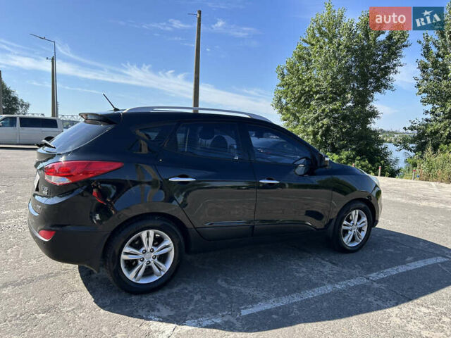 Чорний Хендай іх35, об'ємом двигуна 2 л та пробігом 196 тис. км за 12900 $, фото 2 на Automoto.ua