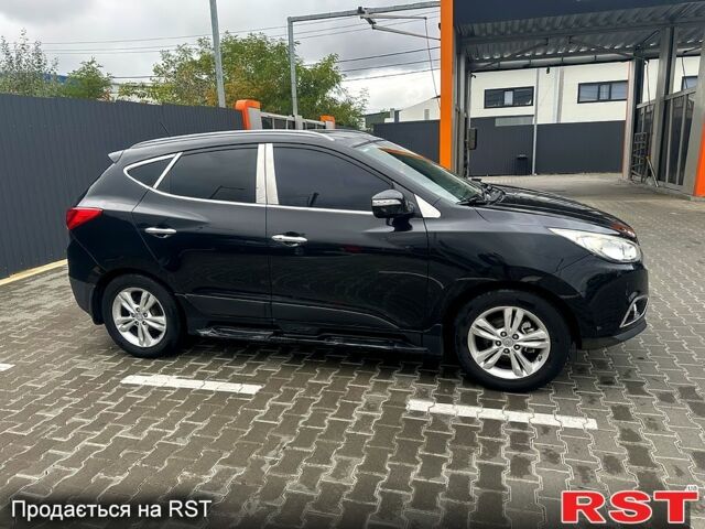 Чорний Хендай іх35, об'ємом двигуна 2 л та пробігом 116 тис. км за 10800 $, фото 3 на Automoto.ua