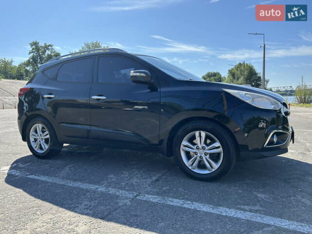 Чорний Хендай іх35, об'ємом двигуна 2 л та пробігом 196 тис. км за 12900 $, фото 3 на Automoto.ua