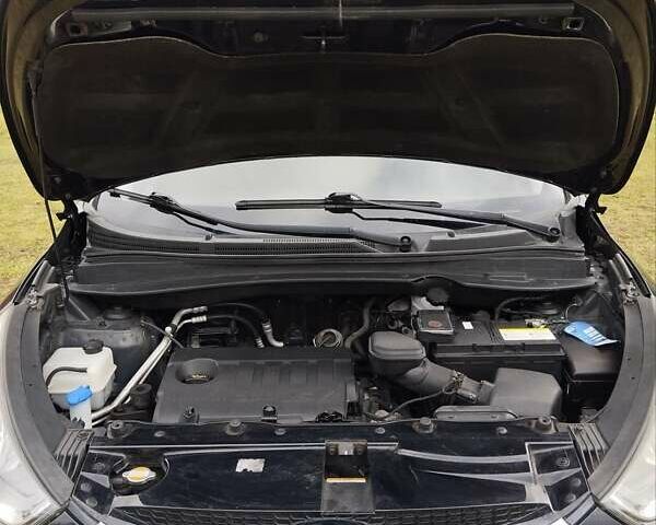 Черный Хендай их35, объемом двигателя 1.69 л и пробегом 250 тыс. км за 11888 $, фото 14 на Automoto.ua