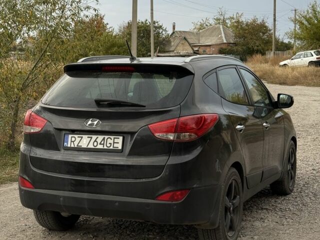 Чорний Хендай іх35, об'ємом двигуна 2 л та пробігом 237 тис. км за 7100 $, фото 5 на Automoto.ua