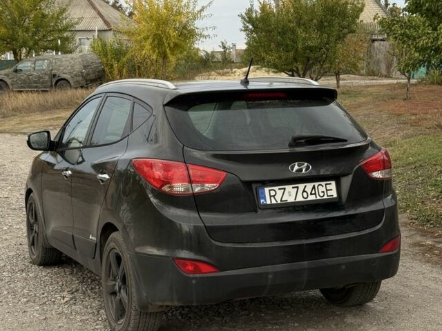 Чорний Хендай іх35, об'ємом двигуна 2 л та пробігом 237 тис. км за 7100 $, фото 3 на Automoto.ua