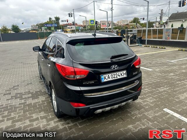 Чорний Хендай іх35, об'ємом двигуна 2 л та пробігом 116 тис. км за 10800 $, фото 2 на Automoto.ua