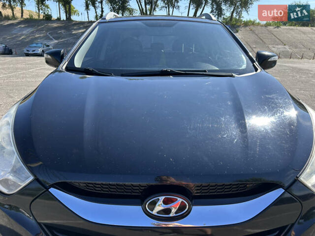 Чорний Хендай іх35, об'ємом двигуна 2 л та пробігом 196 тис. км за 12900 $, фото 6 на Automoto.ua