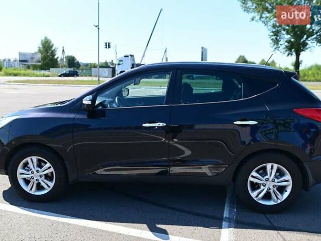 Чорний Хендай іх35, об'ємом двигуна 2 л та пробігом 226 тис. км за 10990 $, фото 5 на Automoto.ua