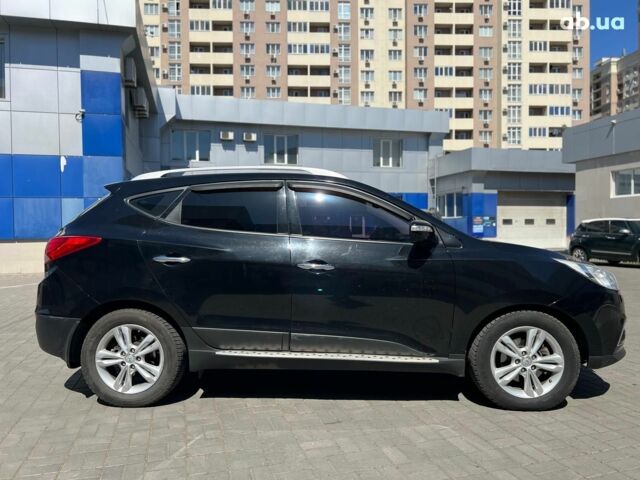 Чорний Хендай іх35, об'ємом двигуна 2 л та пробігом 218 тис. км за 12990 $, фото 5 на Automoto.ua