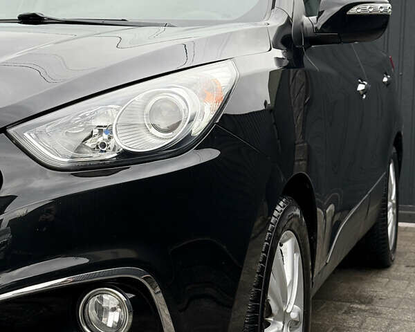 Чорний Хендай іх35, об'ємом двигуна 2 л та пробігом 206 тис. км за 13099 $, фото 14 на Automoto.ua