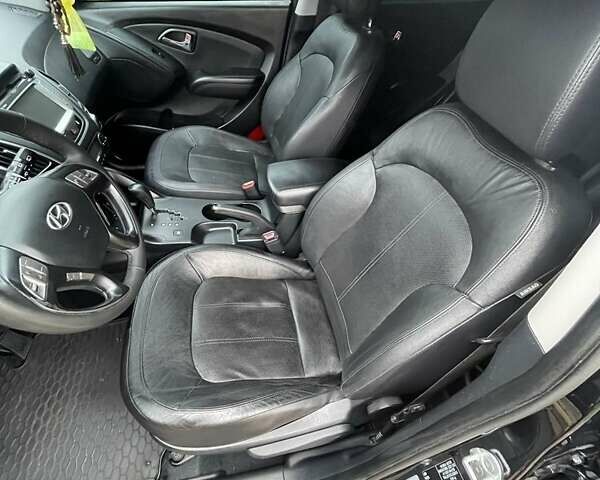 Чорний Хендай іх35, об'ємом двигуна 2 л та пробігом 210 тис. км за 12700 $, фото 4 на Automoto.ua