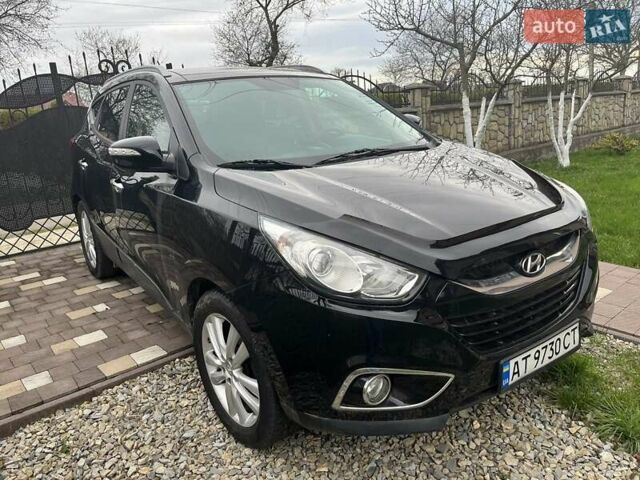 Чорний Хендай іх35, об'ємом двигуна 2 л та пробігом 181 тис. км за 12200 $, фото 4 на Automoto.ua